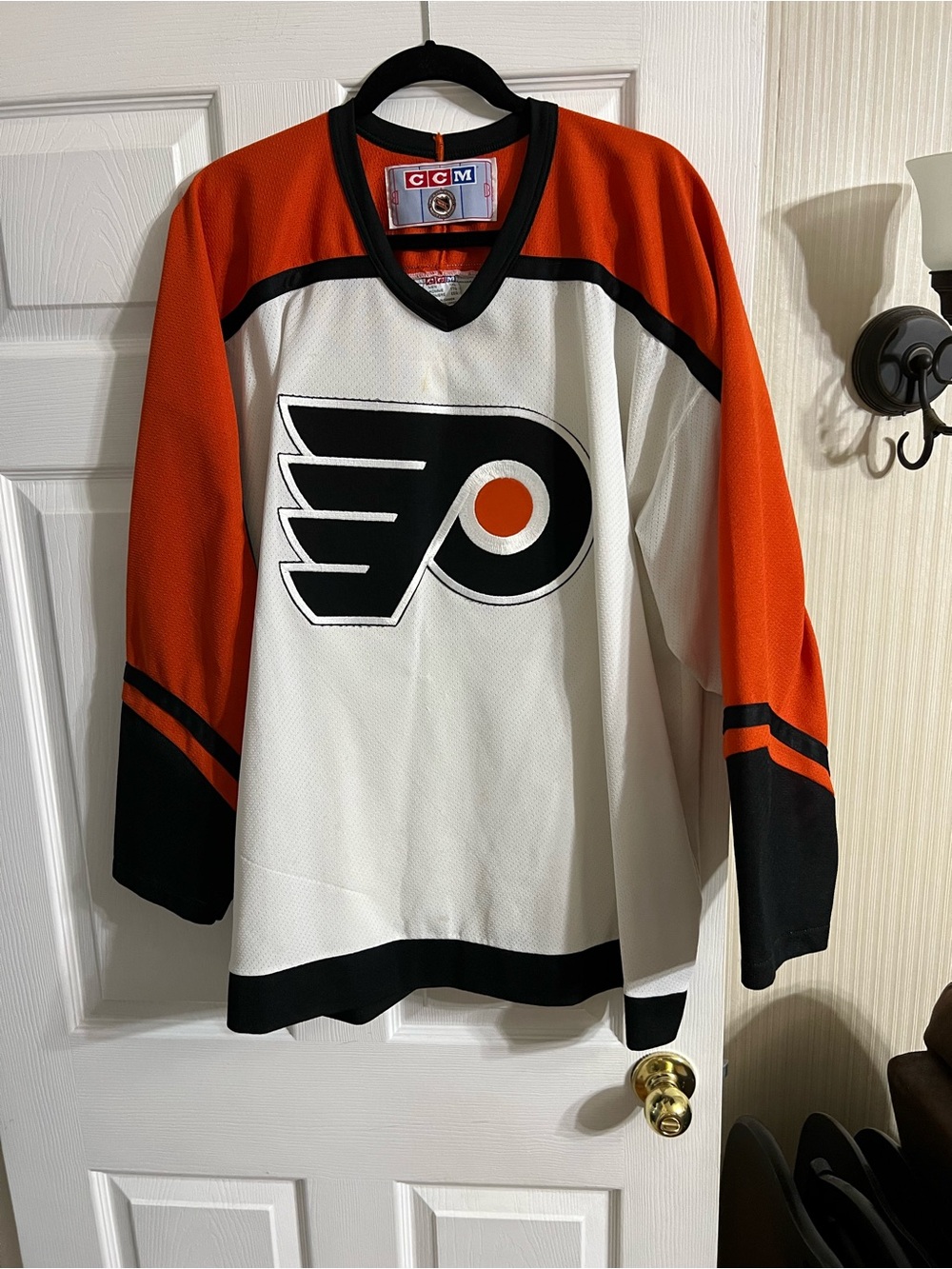 CCM Black, White & Orange Hockey Jersey with Team Crest